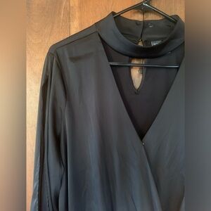 Black, long sleeve blouse with rolled hem. NWT